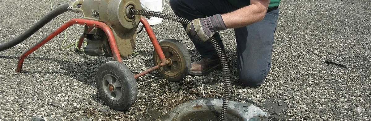 sewer rodding technician actively removing blockages from a sewer line in New Orleans, LA