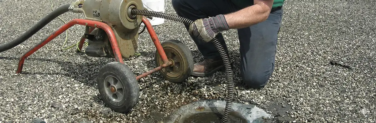 sewer rodding technician actively removing blockages from a sewer line in New Orleans, LA